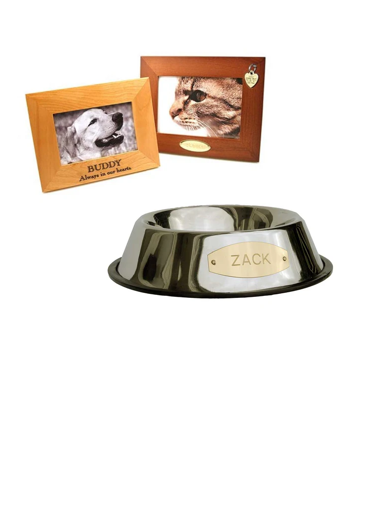 A stainless steel dog or cat food bowl with an engraved brass plaque that says "Zack", and a wood picture frame engraved below the photo with: "Buddy, Always in our hearts".